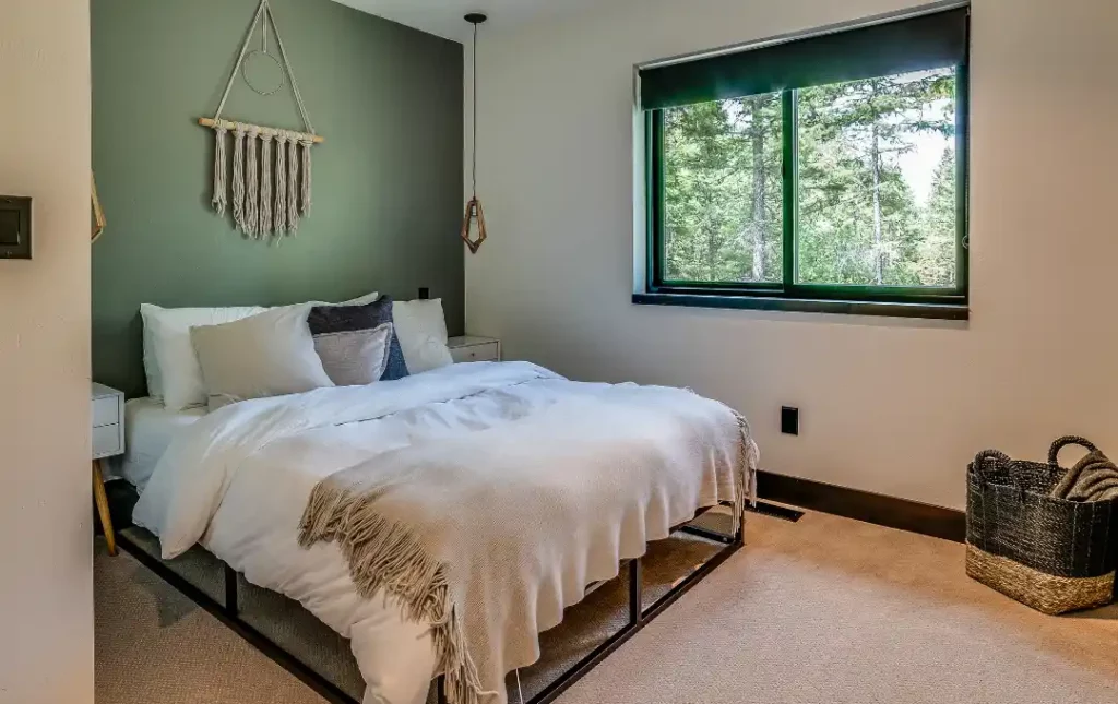 Small bedroom with green accent wall