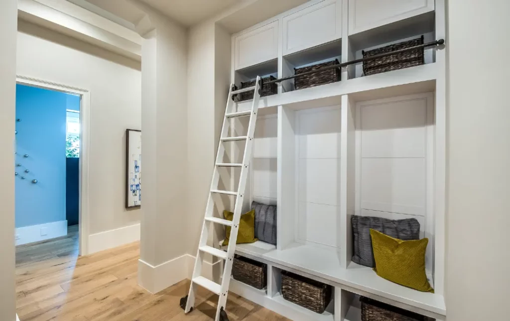 White storage shelves with access ladder