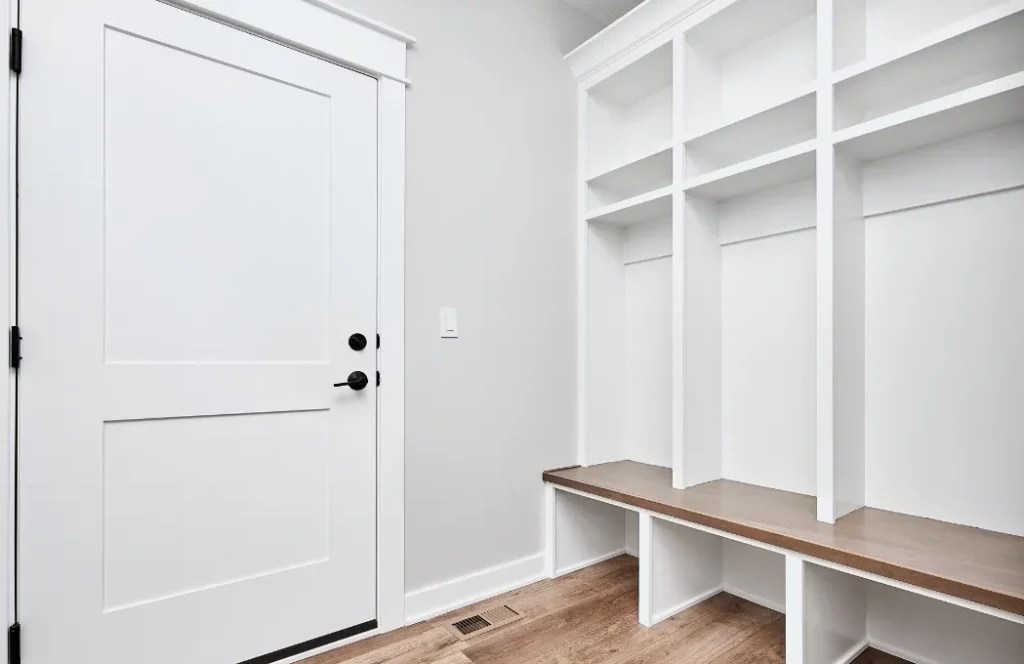 White room with custom shelves and storage