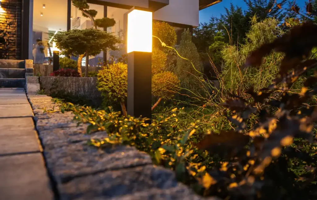Walkway to modern home with sidewalk lighting