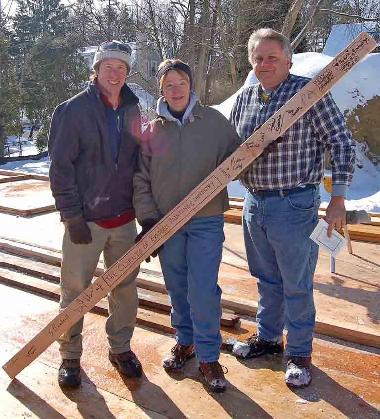 Bill Bradsell with 2 others at construction site in winter